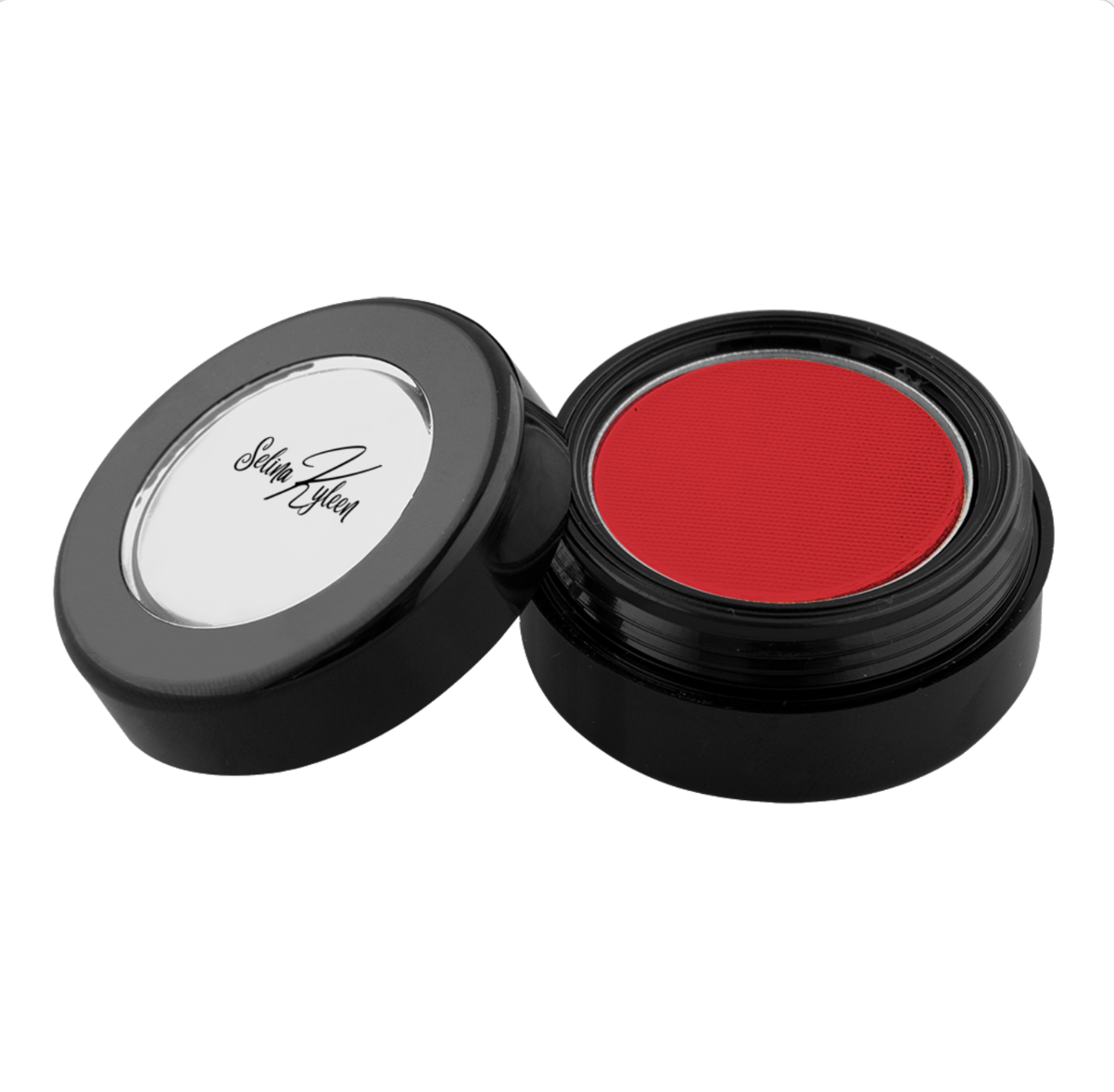 Red cream makeup in open black round container with Selin Kufen branding on lid