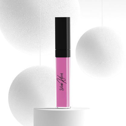 Satin Queen pink liquid lipstick in clear tube with black cap, modern white background